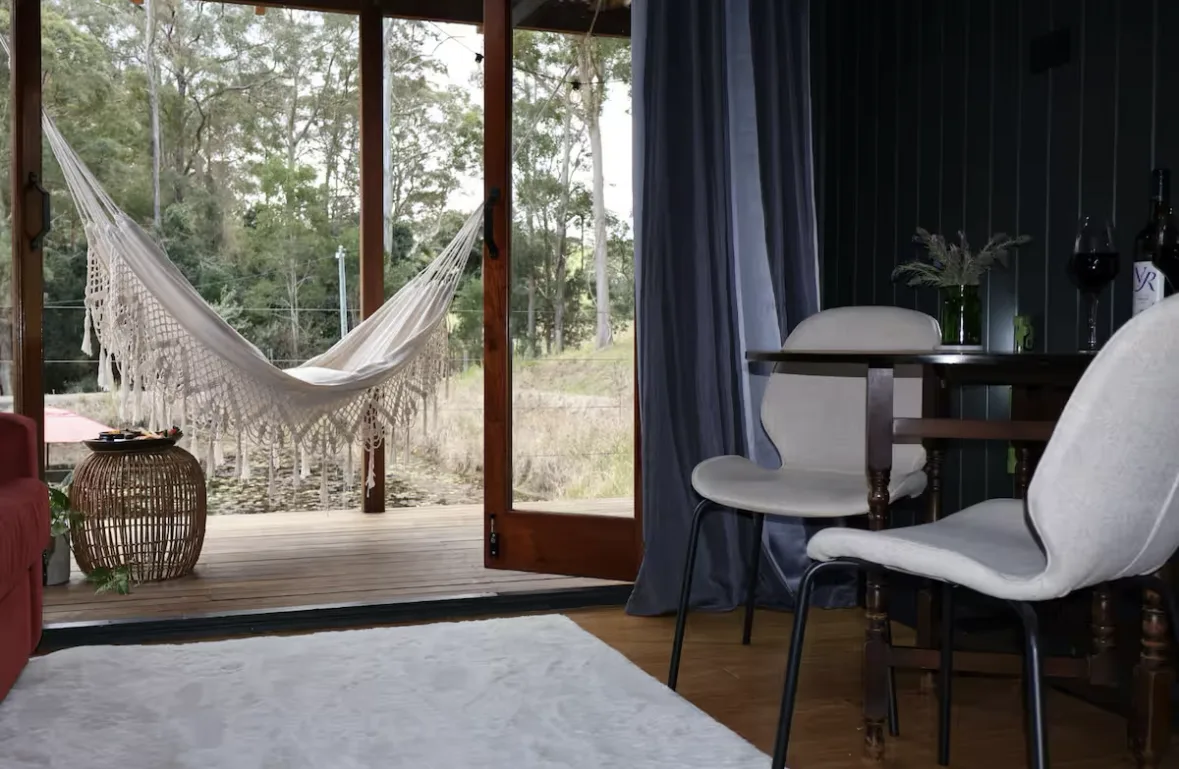 Doors open from the dining nook onto the hammock deck